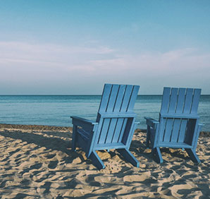 Two chairs on a beach. Link to Donor-Advised Funds