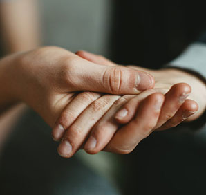 People holding hands. Links to Beneficiary Designations