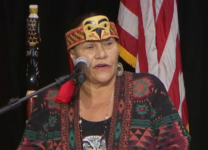 Photo of a woman talking. Link to Life Stage Gift Planner Ages 60-70 Situations.