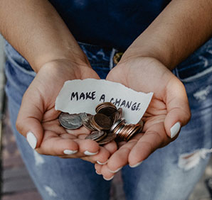 A person holding money. Links to Gifts That Pay You Income